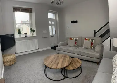a living room with a couch and a coffee table at 1 The Croft in Cockermouth