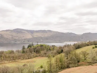 a view of a lake with mountains in the background at Apartment 2 Blencathra in Keswick