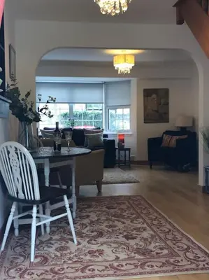 a living room with a table and a couch at Best location in town, it is all on the doorstep. in Ayr