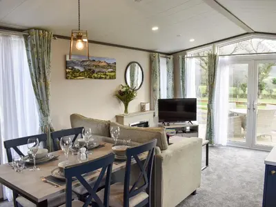 a living room with a table and a couch at Dodd - Uk42499 in Bassenthwaite