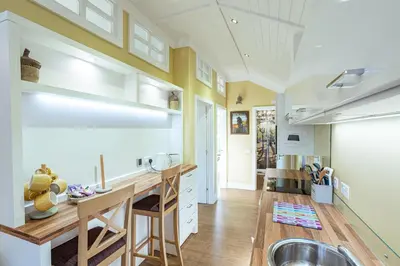 a kitchen with a counter and a sink in a room at Squirrel Lodge 41 with Hot Tub in Newton Stewart