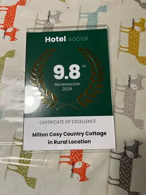 a sign for a hotel for a certificate of excellence in rural location at Cosy country cottage in rural location in Moffat