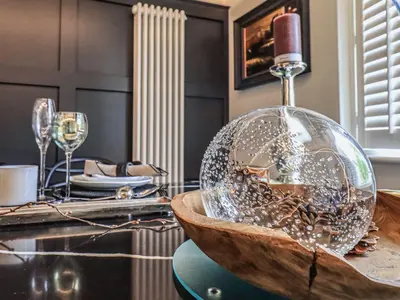 a kitchen with a glass bowl on a table at Whisk Away Cottage in Penrith