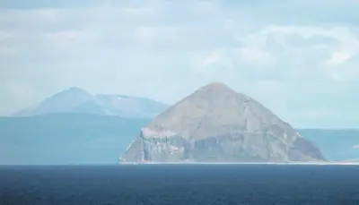 a large mountain in the middle of the ocean at Home Farm Cottage in Stranraer