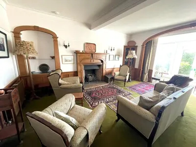 a living room with couches and a fireplace at Beautiful 4BR Period Home With Spectacular Views - Pass the Keys in Kippford