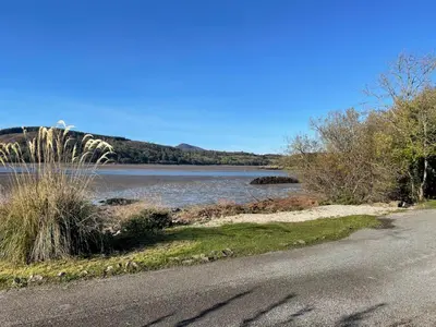 a road next to a body of water at Beautiful 4BR Period Home With Spectacular Views - Pass the Keys in Kippford