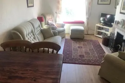 a living room with a couch and a table at Cottage - Sleeps 4 - Pets Ok - Garden - Parking in Keswick