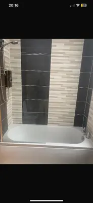 a bath tub in a bathroom with a shower at Elegant bungalow in Newmilns, East Ayrshire in Newmilns