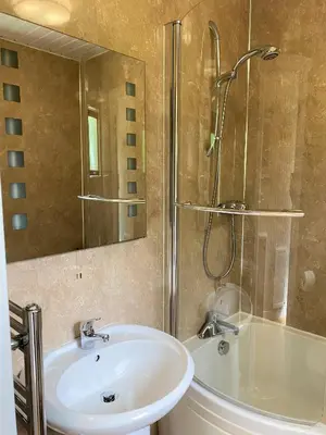a bathroom with a sink and a shower at Birch Lodge 18 with Hot Tub in Newton Stewart