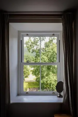 a window with a view of a yard at 5 Greta Side Court in Keswick