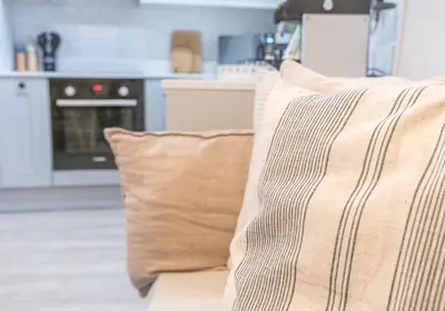 a couch with two pillows on it in a kitchen at Brandelhowe in Keswick