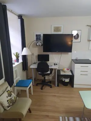 a room with a desk with a computer and a chair at HAVEN STUDIO GROUND FLOOR in Whitehaven