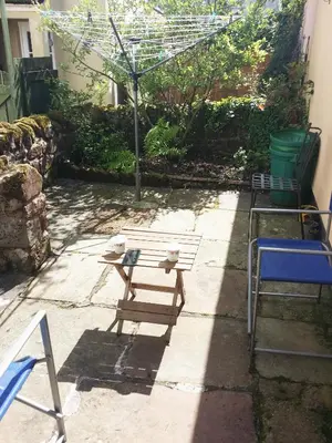 a bench and a table in a yard at HAVEN STUDIO GROUND FLOOR in Whitehaven