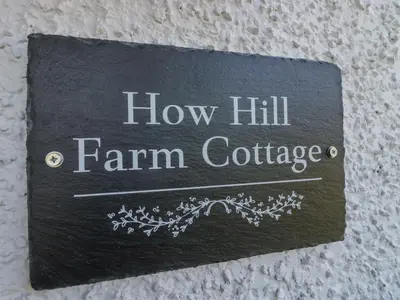 a sign that says how hill farm cottage at How Hill Farm Cottage in Penrith