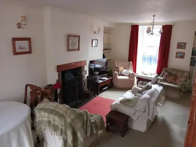 a living room with a couch and a fireplace at lake District cottage in Bootle