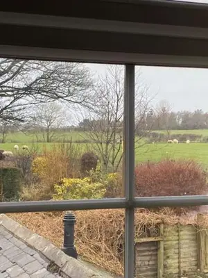 a view of a field from a window at lake District cottage in Bootle