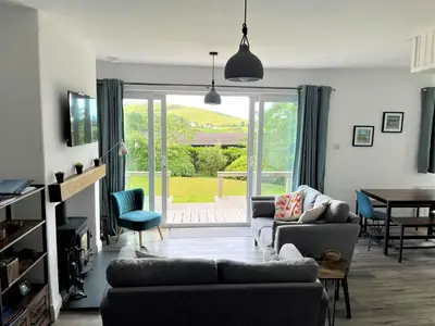 a living room with a couch and a table at Mallaig in Rockcliffe