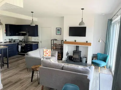 a living room with two couches and a fireplace at Mallaig in Rockcliffe