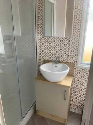a bathroom with a sink and a shower at Grasmere Lodge Unit 31 in Carlisle
