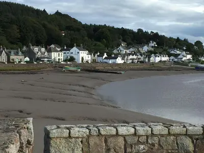 a view of a beach with houses and a town at Birchlea in Kippford
