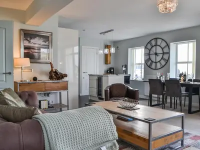 a living room with a couch and a table at Quayside7 in Whitehaven
