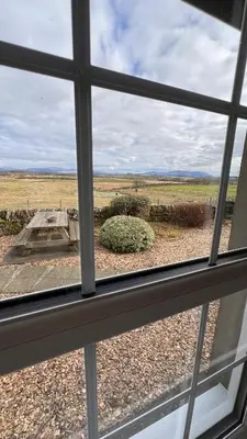 a view of a field from a window at Popsal in Kirkcowan