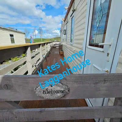 a wooden ramp leading up to a house at Kates Home Lagganhouse Woodland Way 19 in Ballantrae