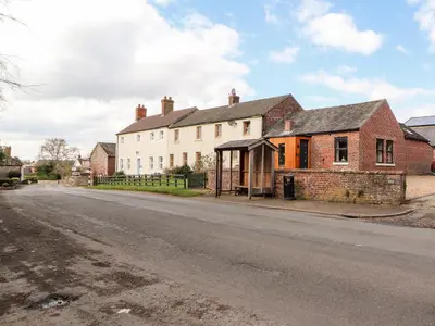 an old house on the side of a street at The Flat in Carlisle
