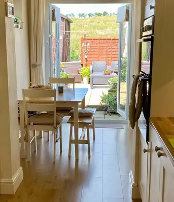 a kitchen and dining room with a table and chairs at Spacious Holiday Home in Cumbria in Arlecdon