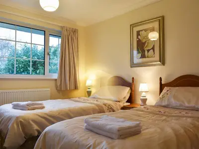 a bedroom with two beds with towels on them at Brow Riding in Keswick