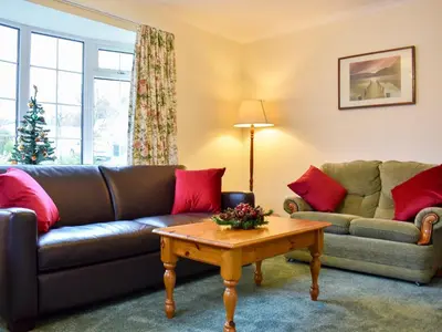 a living room with a couch and a coffee table at Brow Riding in Keswick