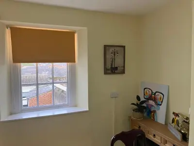 a room with a window with a window shade at Bells yard Cottage Maryport in Maryport