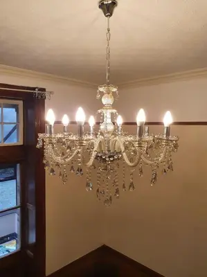 a chandelier hanging from a ceiling in a room at Eta's Manor @ Brooklands in Maryport